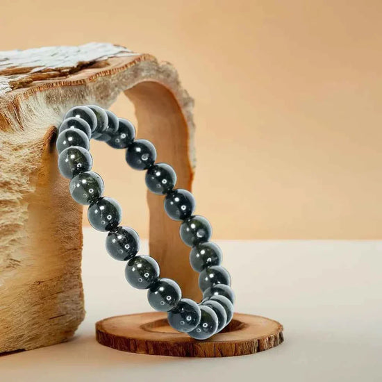 black obsidian bracelet, natural black obsidian stone bracelet, protection grounding gemstone, negativity cleansing crystal, emotional balance stone jewelry, daily wear spiritual bracelet, protective gemstone bracelet, bracelet by acharya lavbhushan