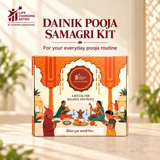 Dainik Pooja Samagri Kit. Orange and ivory product box on a warm stone surface.