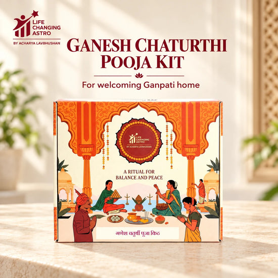 Ganesh Chaturthi Pooja Kit. Orange and ivory product box on a warm stone surface.