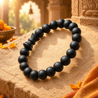 Karungali Damru Bracelet on warm sandstone