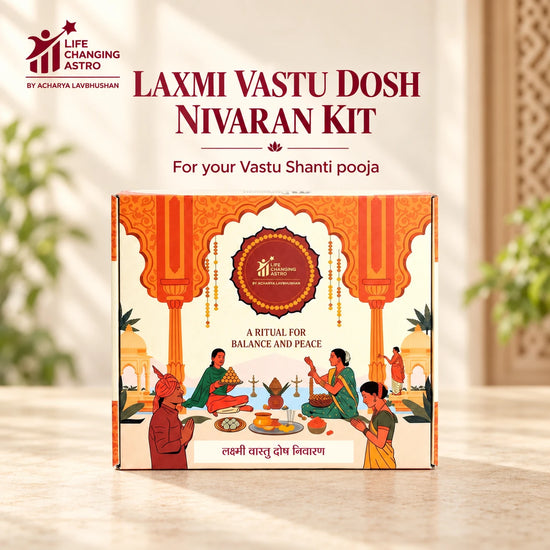 Laxmi Vastu Dosh Nivaran Kit. Orange and ivory product box on a warm stone surface.