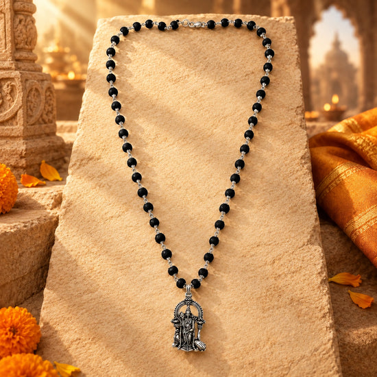Original Karungali Mala with Silver Plated Lord Murugan Pendant on warm sandstone