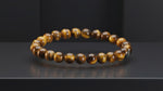 
                    
                      Load and play video in Gallery viewer, Natural Tiger&amp;#39;s Eye Bracelet for courage and focus by Acharya Lavbhushan

                    
                  